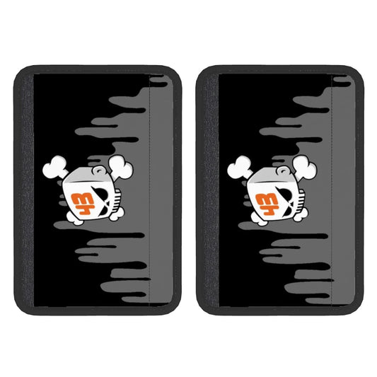 Two black neoprene seat belt cover pads with a white cartoon car design on the front.