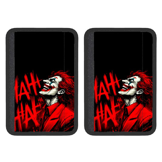 Two neoprene seat belt cover pads with a red and black design featuring a character's face.