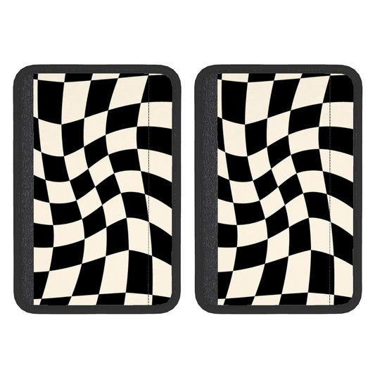 Two checkered flag seat belt cover pads with a black and white geometric pattern