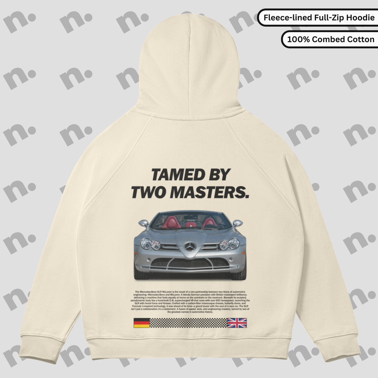 Flat lay of full-zip hoodie featuring bold “TAMED BY TWO MASTERS.” car-inspired graphic, raglan sleeves, and fleece-lined interior in a clean, minimalist style.