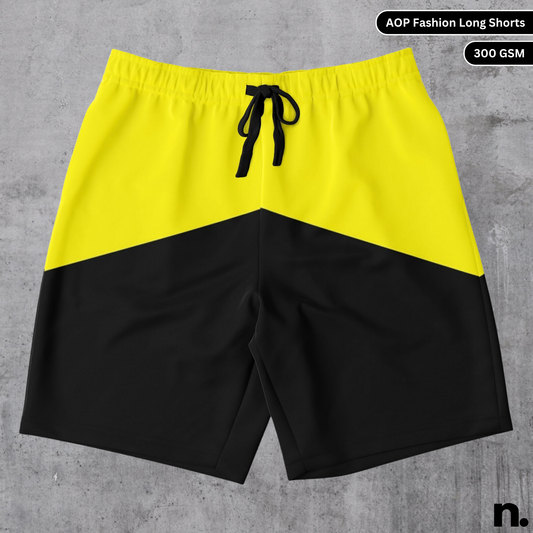 Flat lay of yellow and black dual-color long shorts featuring bold colors and a streetwear design