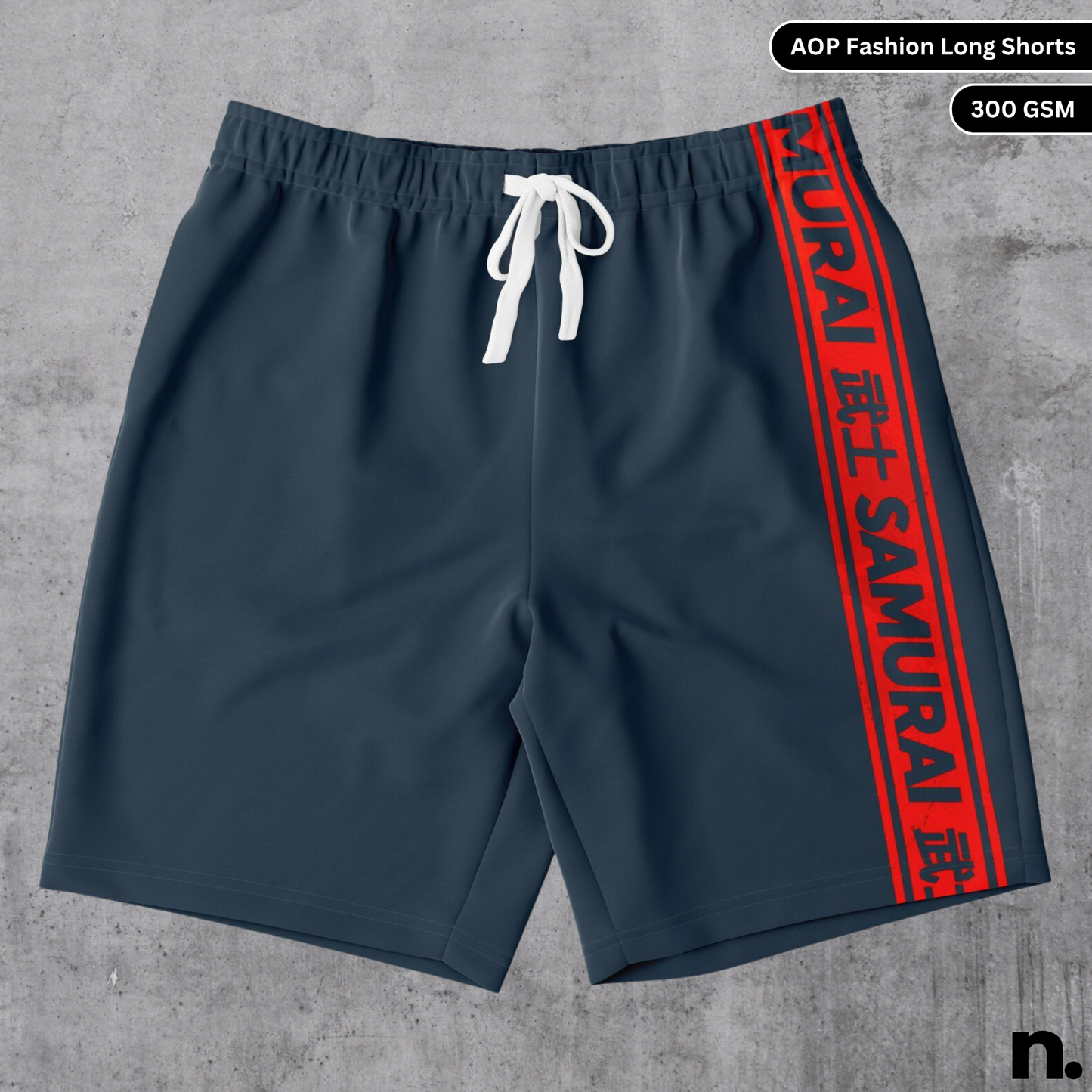 A flat lay of men's long shorts with an all-over print design inspired by samurai armour or imagery, showcasing the drawstring closure and pockets.
