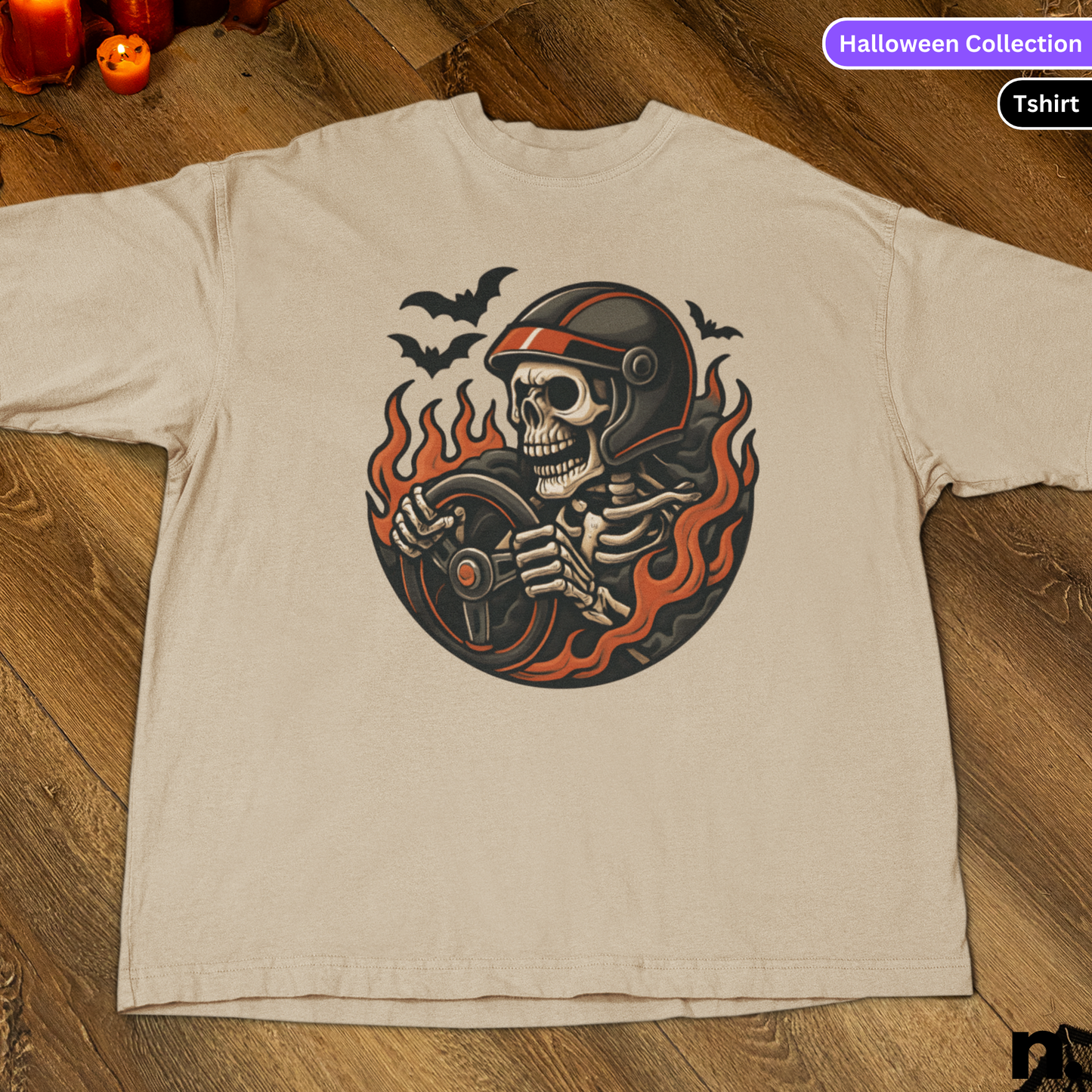 Beige t-shirt with a skeleton design on a wooden surface, labeled 'Halloween Collection'.