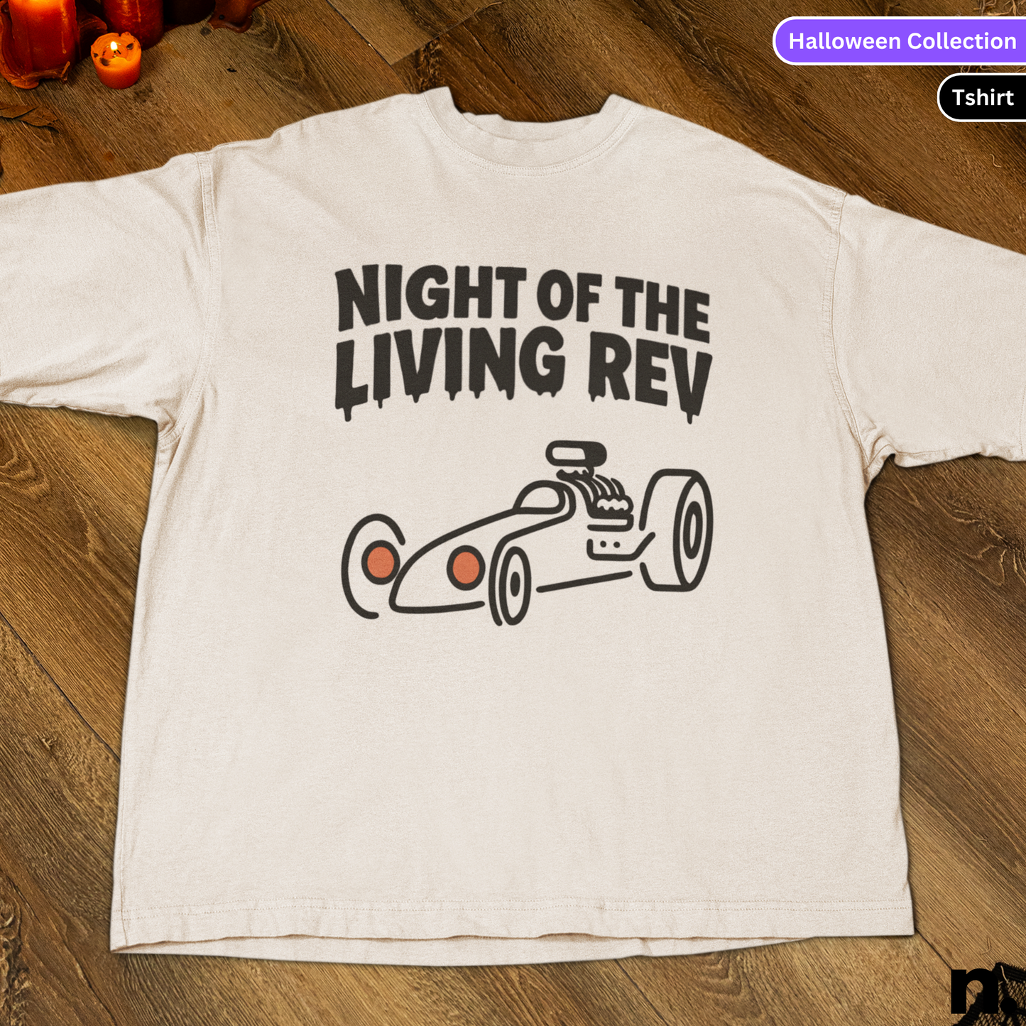 White t-shirt with 'Night of the Living Rev' graphic on a wooden surface