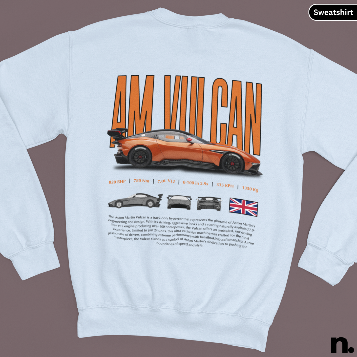 White sweatshirt with orange text and car graphics on a brown background