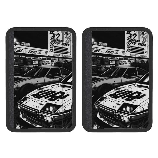 A pair of neoprene seat belt cover pads with a black and white car print on them.