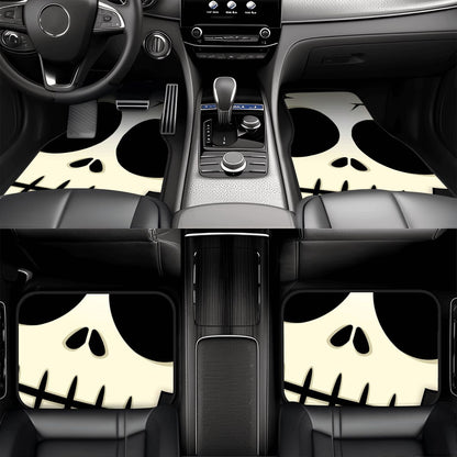 Car interior with skull patterned floor mats on a black background