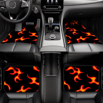 Car interior with flame-patterned floor mats and seat covers.