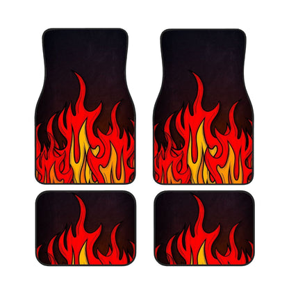 Four car floor mats with flame design on a black background