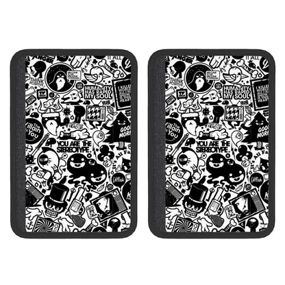 Two rectangular neoprene seat belt cover pads with a black and white doodle art pattern.