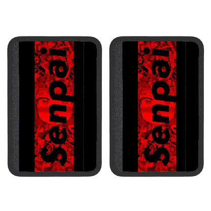 Two black neoprene seat belt cover pads with red text pattern, designed for adult use in vehicles.