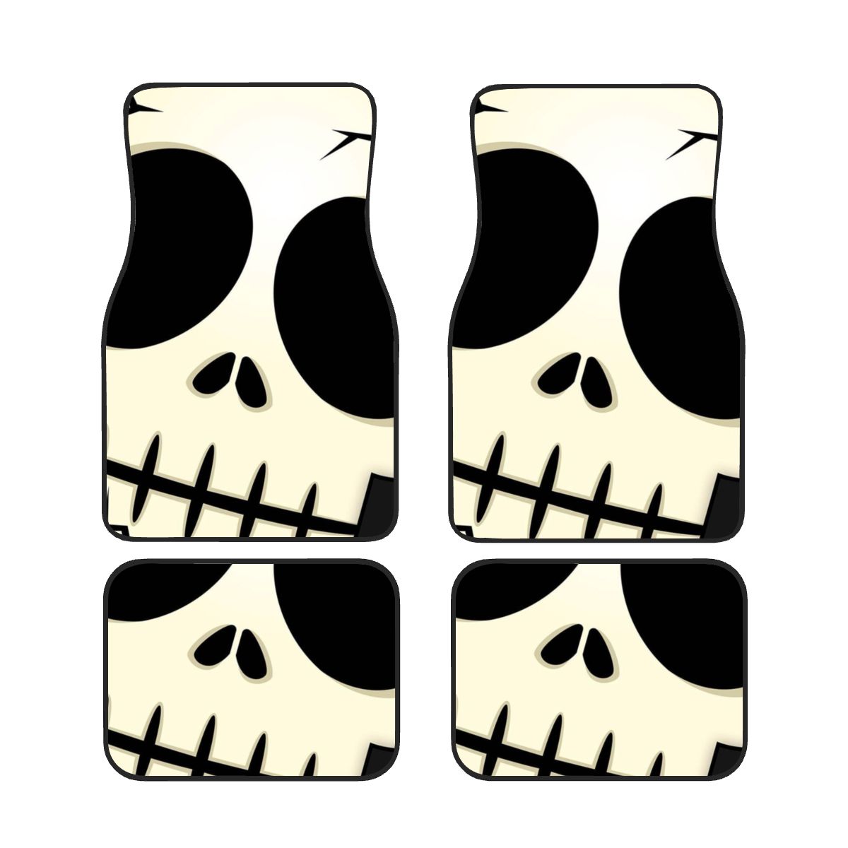 Four skull-shaped coasters with black and white design on a white background