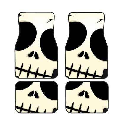Four skull-shaped coasters with black and white design on a white background