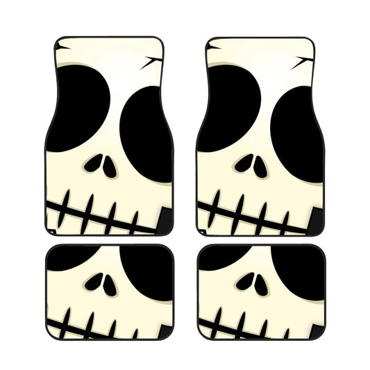 Four skull-shaped coasters with black and white design on a white background
