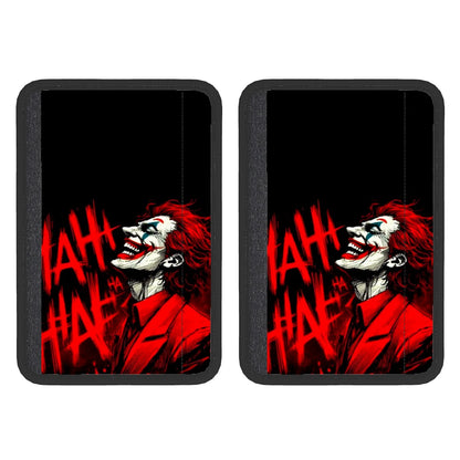 Two neoprene seat belt cover pads with a red and black design featuring a character's face.