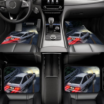 Car interior with custom floor mats featuring a white car design.
