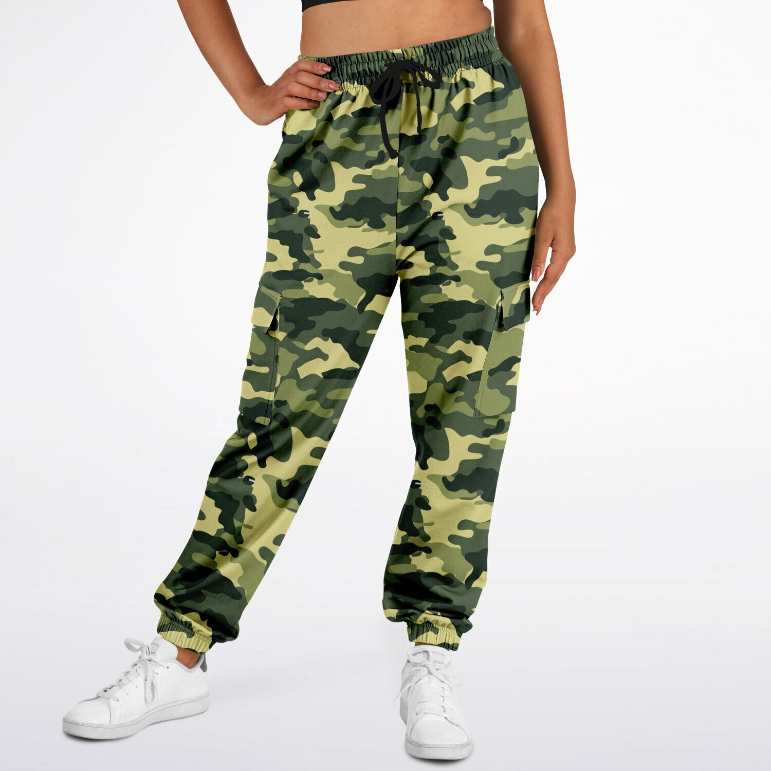 Green camo print fashion joggers product mockup on a female model from front.
