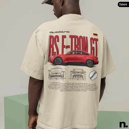 Person wearing a beige t-shirt with a red car design and text on the back.