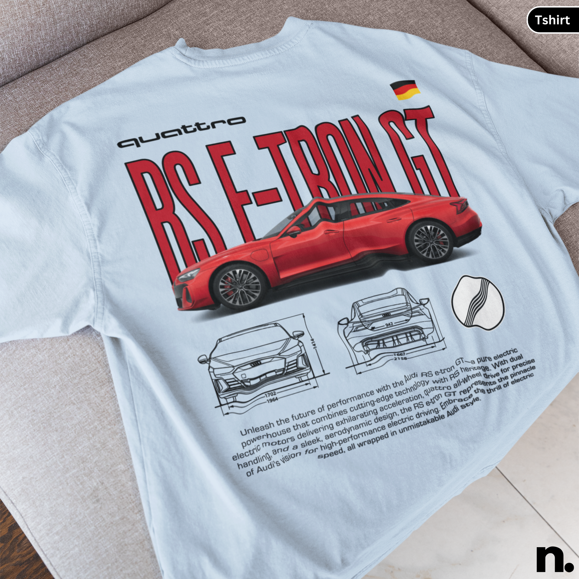 White t-shirt with red Audi RS E-Tron GT design on a beige surface