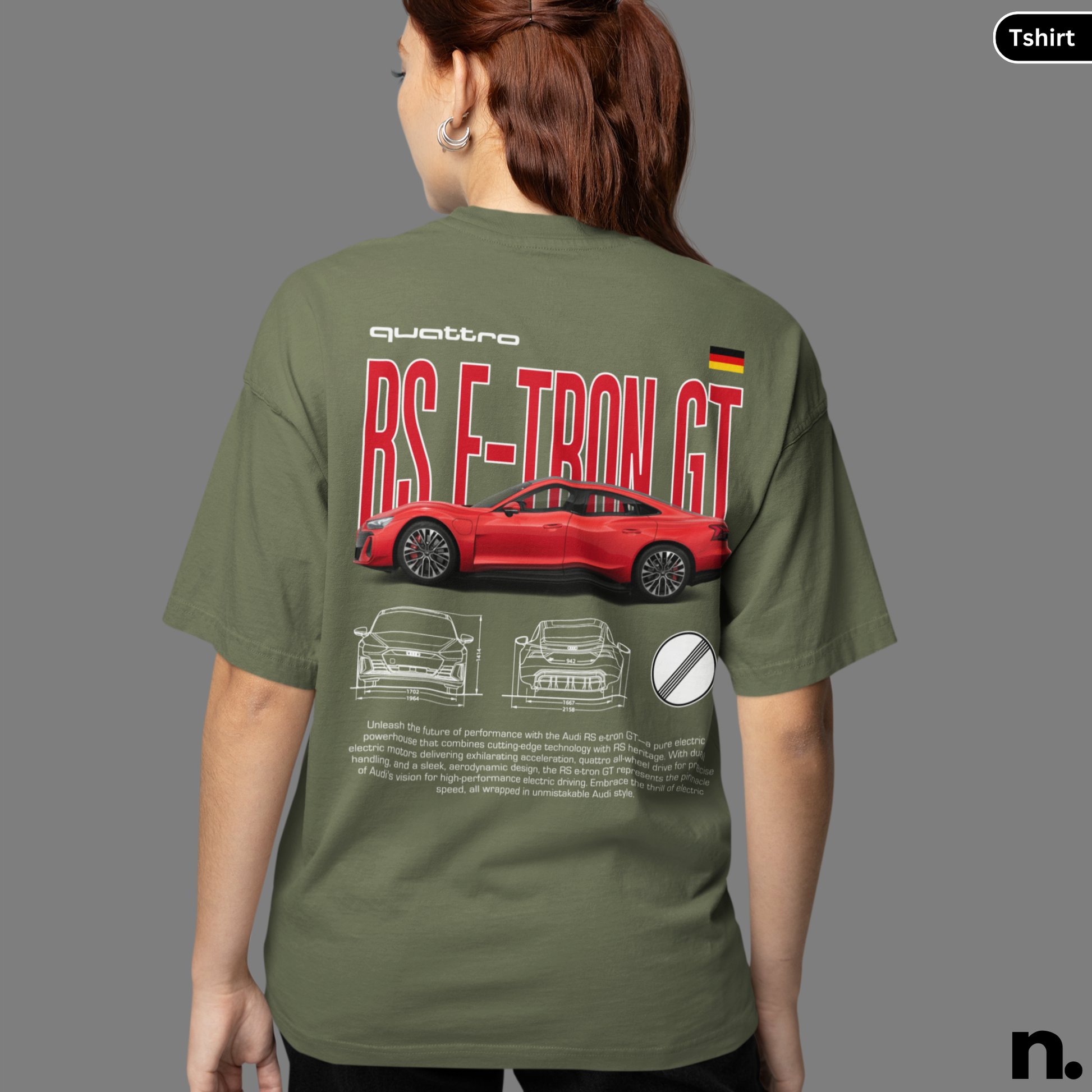 Person wearing a green t-shirt with a red car design and text on the back.