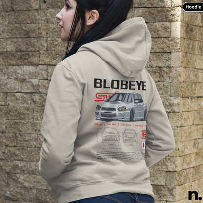 Person wearing a hoodie with 'BLOBEYE' design against a stone wall.
