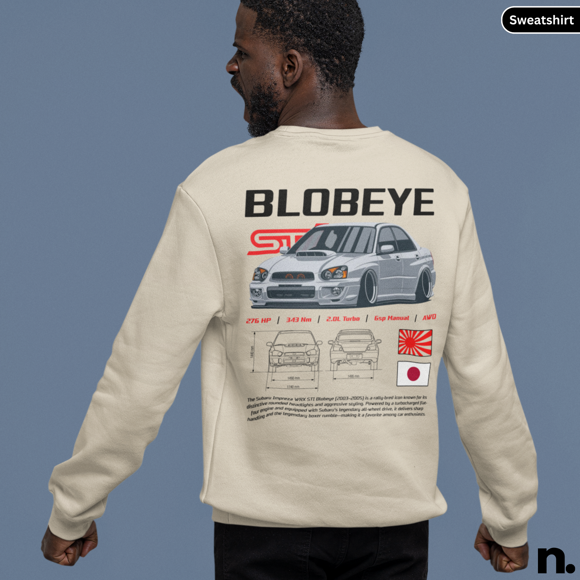 Person wearing a beige sweatshirt with 'BLOBEYE' design on the back, featuring a car illustration and text.