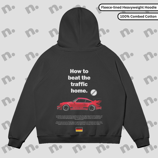 Flat lay of the 911 RWB Autobahn Sun Faded Hoodie with an RWB Porsche graphic and 'How to Beat the Traffic Home' slogan.