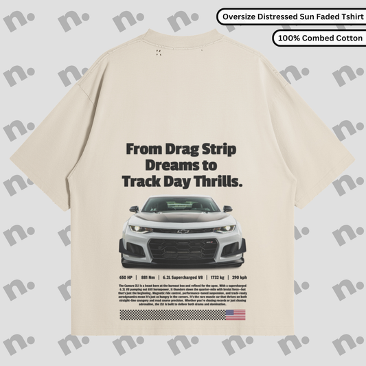 Flat lay of vintage-style oversized graphic tee with washed gradient and distressed details, inspired by classic muscle car energy.