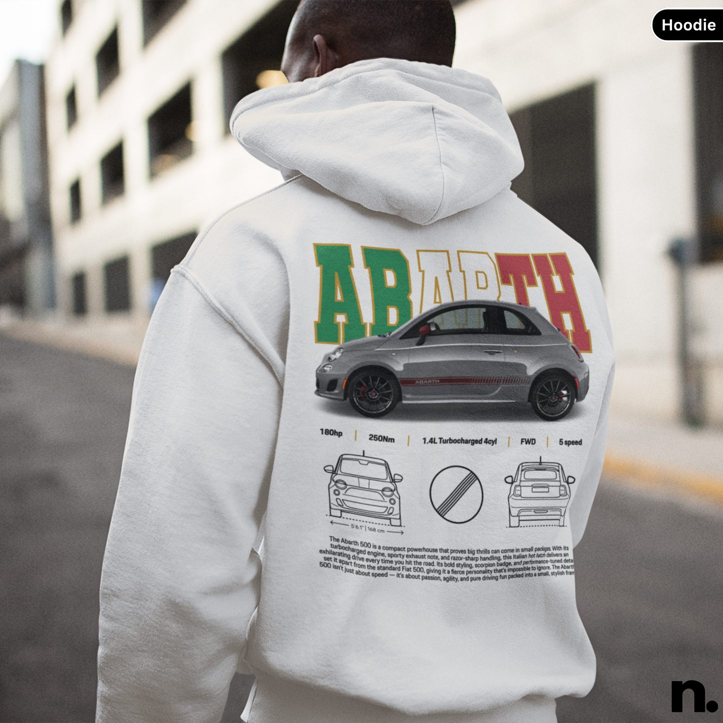 Person wearing a hoodie with a car design and text on the back, standing outdoors. Abarth 500 Poster Style Unisex Hoodie. white
