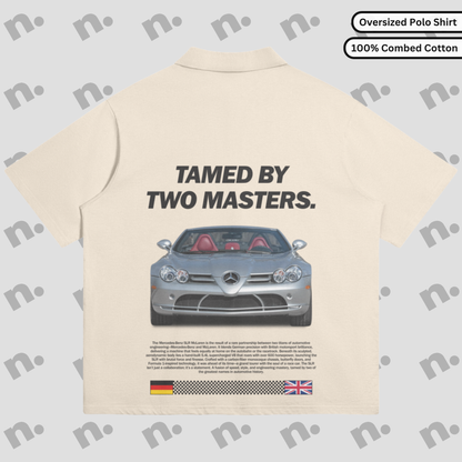 Flat lay of oversized polo shirt featuring “TAMED BY TWO MASTERS.” Mercedes-Benz SLR McLaren graphic, spread collar, and relaxed drop shoulder fit in earth-tone color palette.