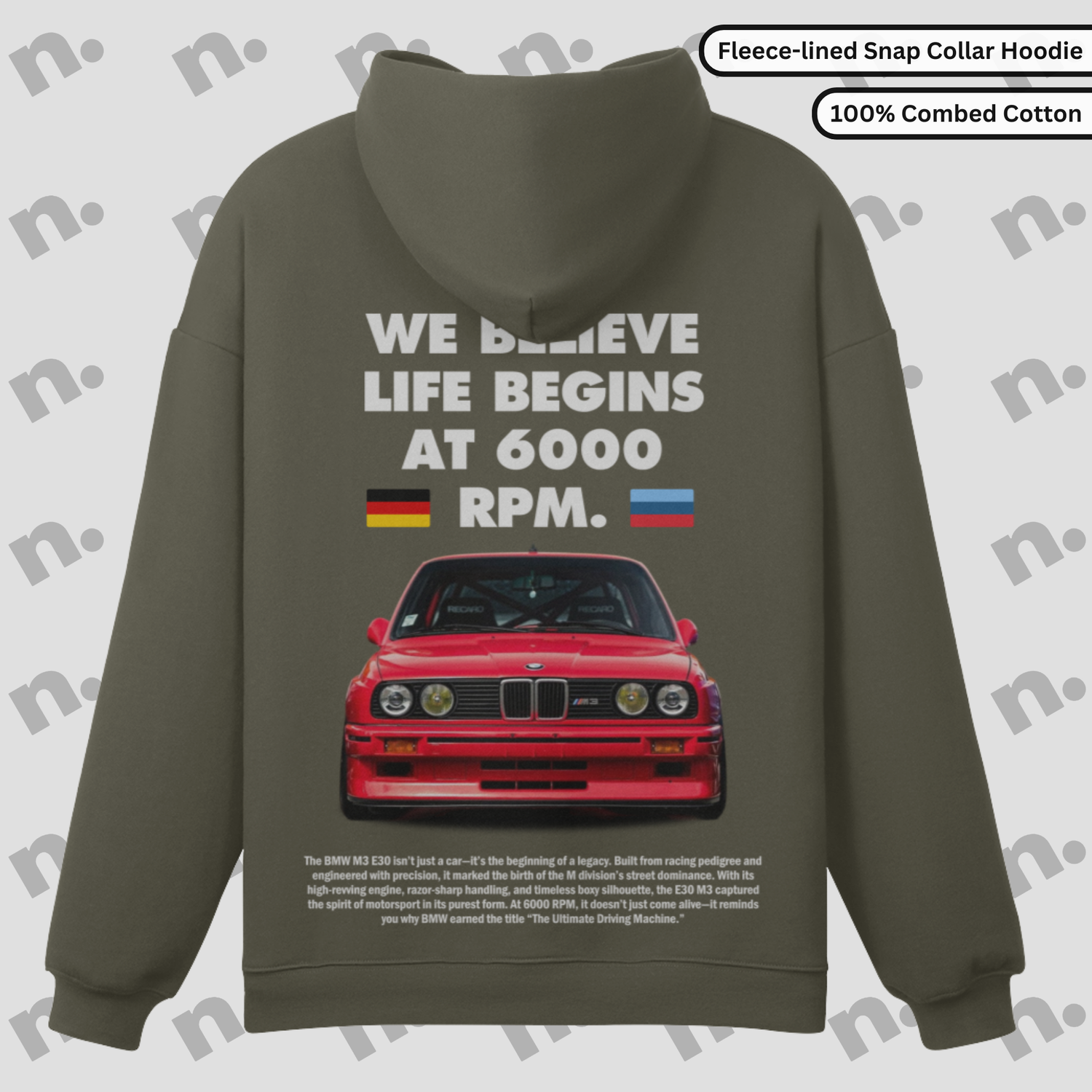 Flat lay of a premium snap-collar hoodie featuring a BMW E30 M3 design and the text "Life Begins at 6000 RPM", paired with minimalist accessories on a clean background.