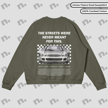 Heavyweight earth-toned fleece pullover with raglan sleeves and relaxed fit inspired by motorsport design.
