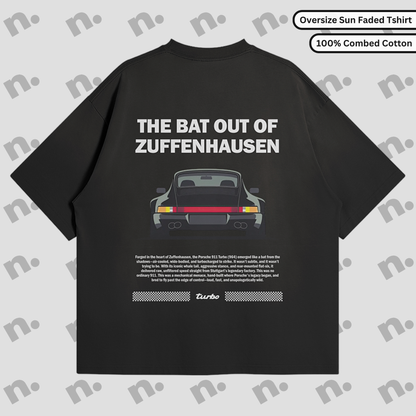 Flat lay of Zuffenhausen Bat 911 premium oversized T-shirt in vintage washed gradient, featuring soft 100% combed cotton and drop shoulder design.