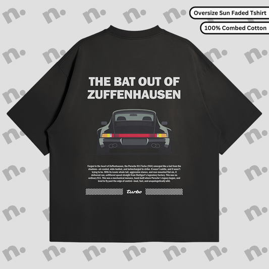 Flat lay of Zuffenhausen Bat 911 premium oversized T-shirt in vintage washed gradient, featuring soft 100% combed cotton and drop shoulder design.