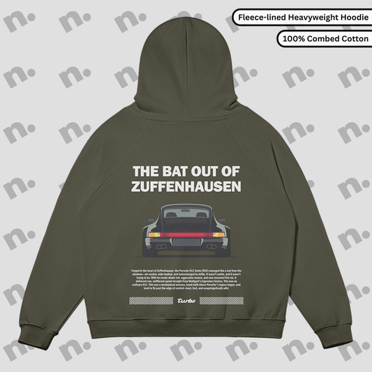 Flat lay of Zuffenhausen Bat 911 heavyweight fleece-lined hoodie in grayscale, with snap collar, kangaroo pocket, and oversized fit.