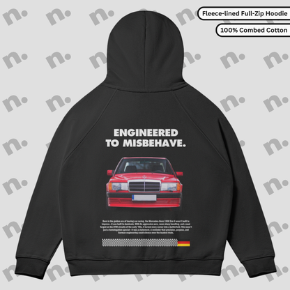 Flat lay of a full-zip fleece hoodie featuring a Mercedes 190E Evo II inspired design, styled with motorsport-themed accessories on a clean, neutral background.