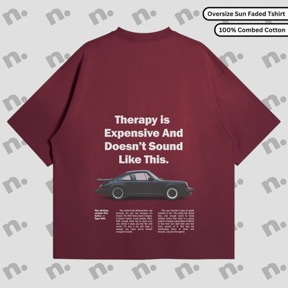 Flat lay of the 911 Therapy Sun Faded T-shirt featuring a classic 911 graphic and 'Therapy is Expensive' slogan.
