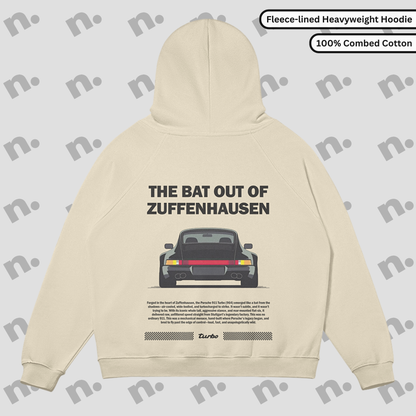 Flat lay of Zuffenhausen Bat 911 heavyweight fleece-lined hoodie in grayscale, with snap collar, kangaroo pocket, and oversized fit.