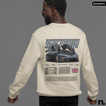 Person wearing a beige sweatshirt with car design and 'Senna' branding on the back.