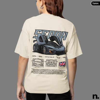 Person wearing a beige t-shirt with a car design and text on the back, on a gray background.