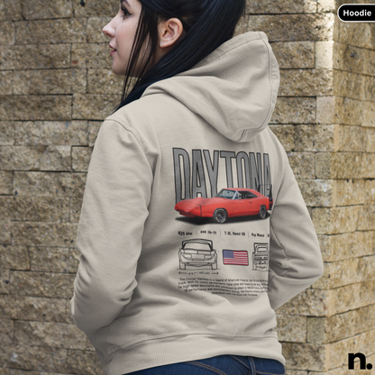 Person wearing a hoodie with a car graphic and 'Daytona' text against a stone wall.