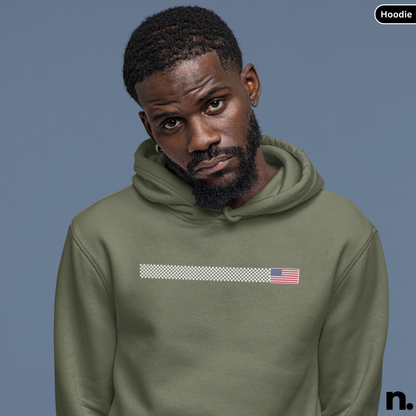 Man wearing a green hoodie with an American flag design on a blue background
