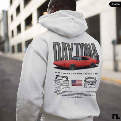 Person wearing a hoodie with 'Daytona' and car graphics on the back, standing in an urban setting.