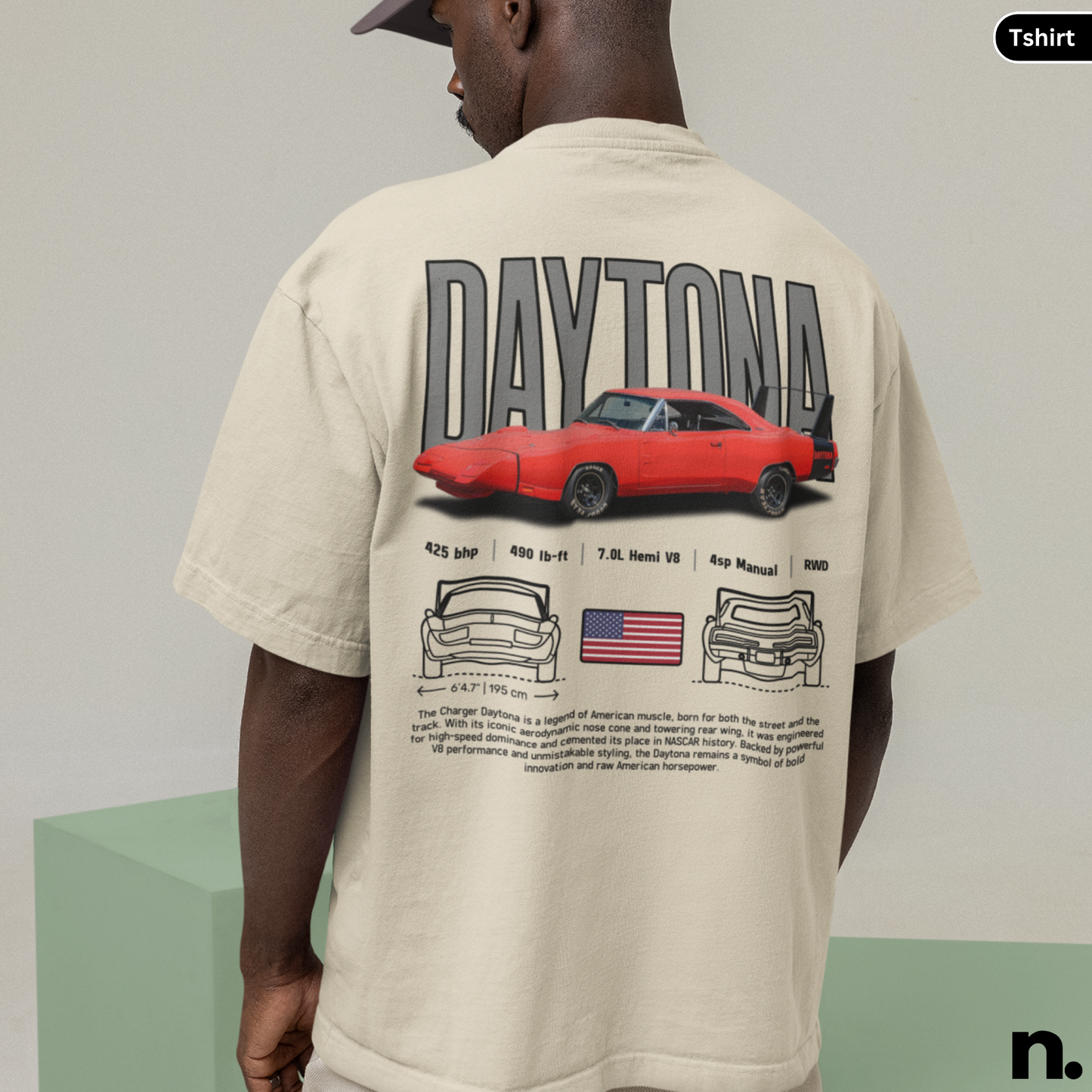 Person wearing a beige t-shirt with a red car graphic and 'Daytona' text on the back.