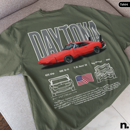 Green t-shirt with red car graphic and 'Daytona' text on a gray surface