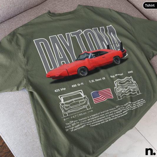 Green t-shirt with red car graphic and 'Daytona' text on a gray surface