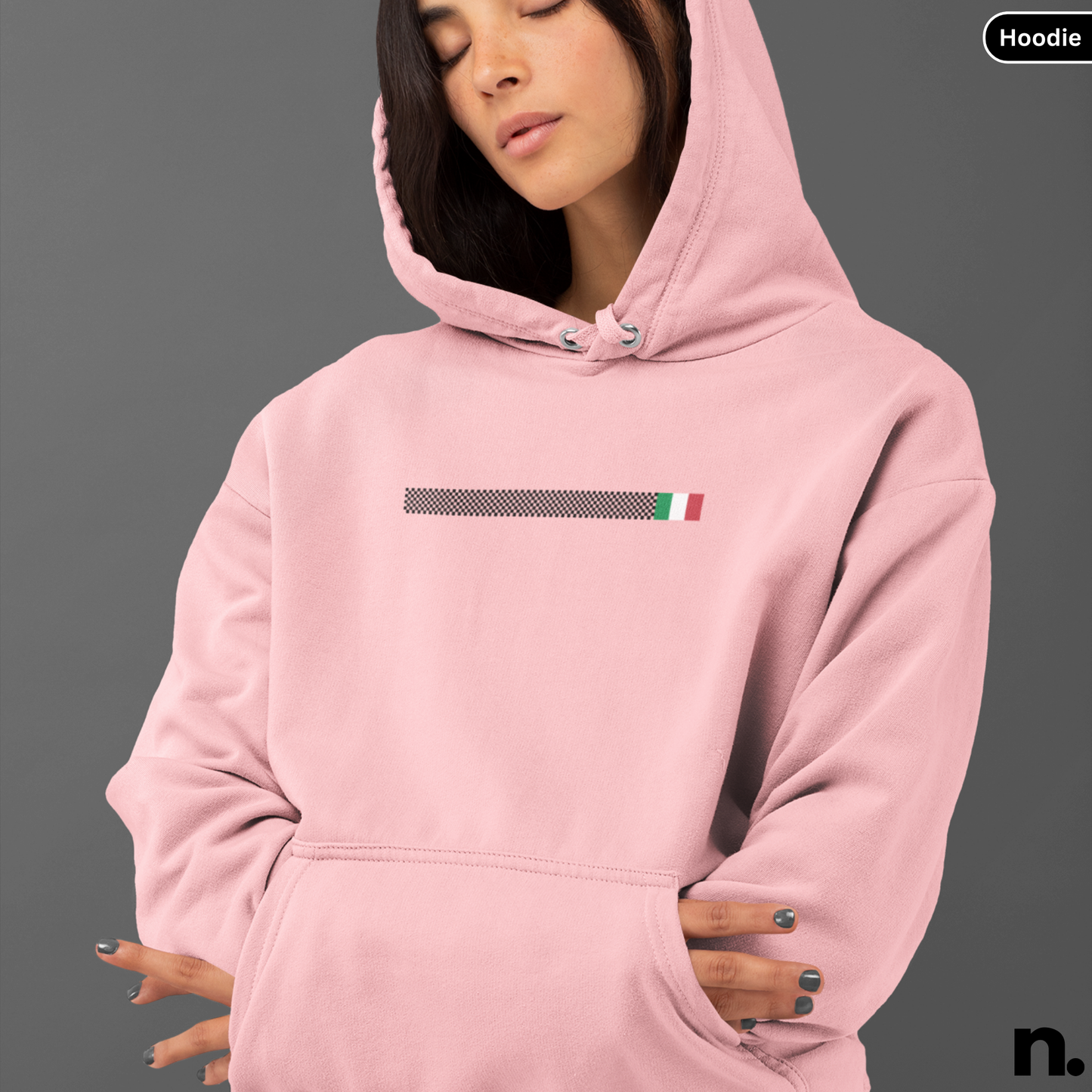 Pink hoodie with a small flag design on a gray background