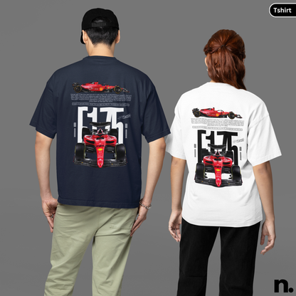 Two people wearing t-shirts with a Formula 1 car design on the back, one navy and one white.