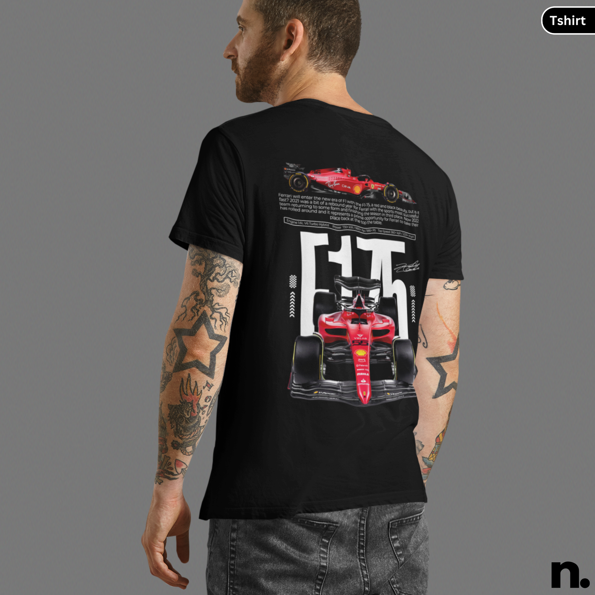 Person wearing a black t-shirt with a red racing car design on the back, on a gray background.