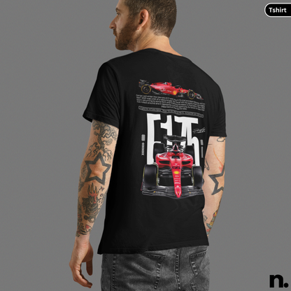 Person wearing a black t-shirt with a red racing car design on the back, on a gray background.